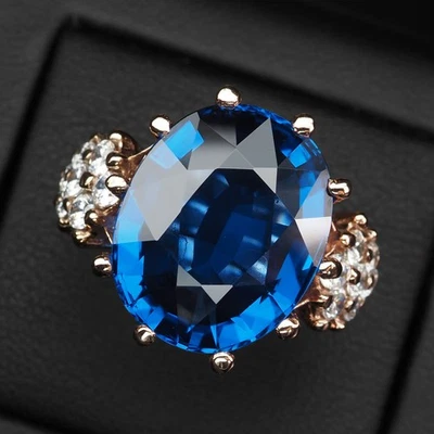 Preciosos anillos enchapados en oro rosa de plata de ley 925 de 21,11 quilates con topacio azul intenso Foto 1 de 4