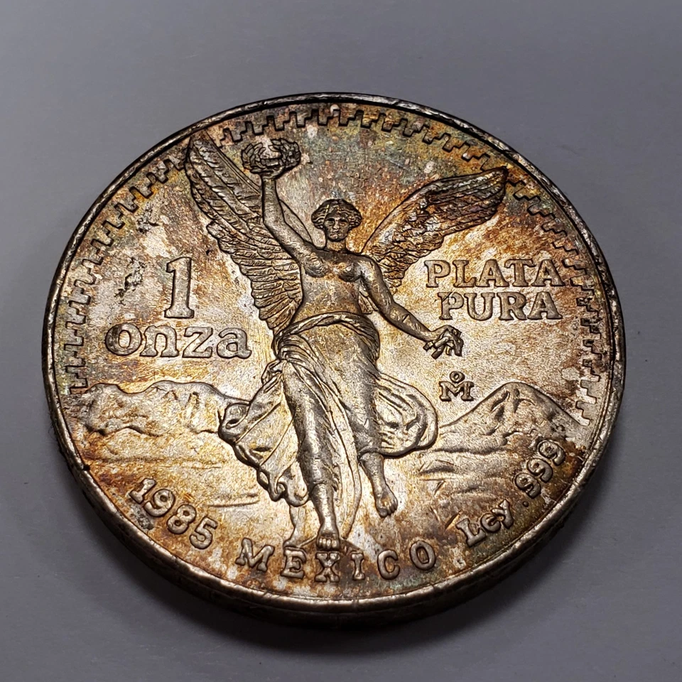 1985 Mo Mexico Libertad Onza 1 oz .999 Silver BU - Rainbow Toning - SKU-U2876 - Image 1 of 4