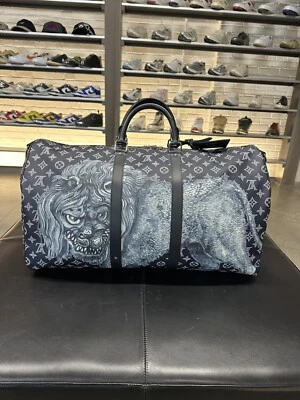 Bandolera Louis Vuitton x Chapman Brothers Keepall monograma tinta sabana 55 Midn Foto 1 de 4
