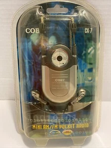 2007 COBY CX-7 Mini AM/FM Pocket Radio DBBS, Earphone, Belt Clip, Neck Strap NIP - Picture 1 of 5