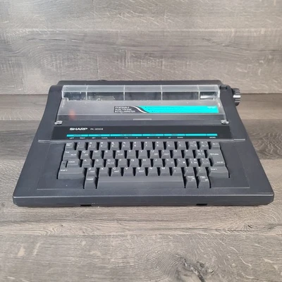 Máquina de escribir eléctrica electrónica portátil Sharp PA-3000II enciende Foto 1 de 4
