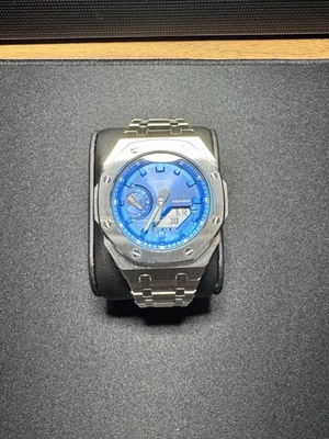 Reloj Casioak para hombre esfera plateada/azul G-Shock Mod GA2100 Foto 1 de 4