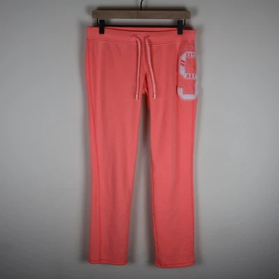 Pantalones deportivos para mujer Abercrombie & Fitch de tiro bajo rosa neón medianos Foto 1 de 4