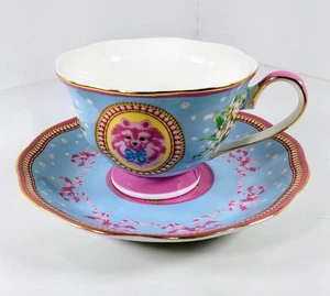 Taza de té y platillo de porcelana Poppy Angeloff Pups on Cups oro 24k rosa descontinuado - Imagen 1 de 7