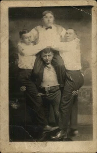 RPPC Chicago,IL One Man Lifting Three Men Illinois Real Photo Postcard - Picture 1 of 5