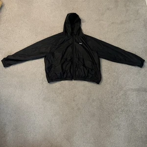 Under Armour Windbreaker Jacke schwarz mit Kapuze Damen 2XL - Bild 1 von 4
