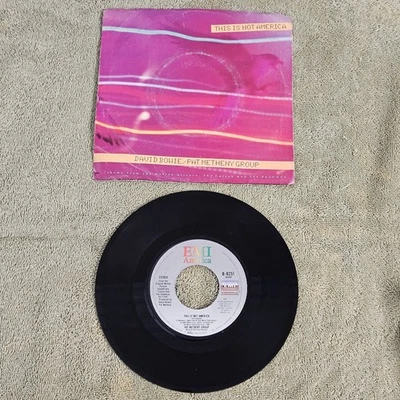 David Bowie / Pat Metheny Group - This Is Not America 7" Single 1985 EMI - Image 1 of 4