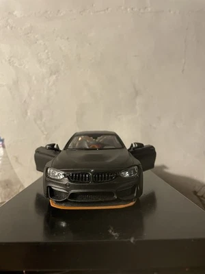 BMW M4 GTS 2016 modelo diecast escala 1/24 de Maisto - gris oscuro - caja Foto 1 de 4
