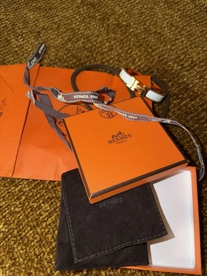 Подлинный браслет Hermès Clic H — белая эмаль / золотая фурнитура - Изображение 1 из 4