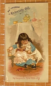 TARJETA COMERCIAL DE ACEITE ELÉCTRICO DEL DR. THOMAS ~ NIÑA ALIMENTA MEDICAMENTOS A SU PERRO ENFERMO - Imagen 1 de 3