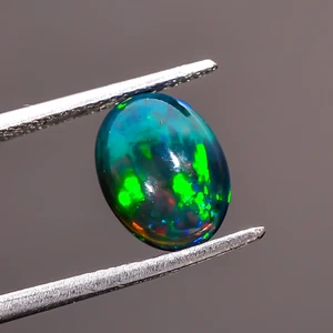 1.9 Ct Explant Black Ethiopian Fire Play Opal Oval Cabochon Gemstone 10X7X4 mm - Picture 1 of 3