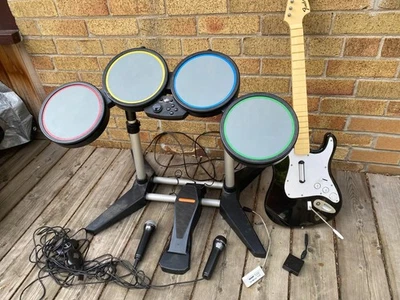 Rock Band Bundle PS3 Console, Wired Drums, Fender Stratocaster W/ Dongle, 2X Mic - Image 1 of 4