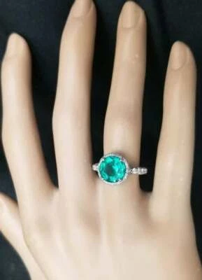 Anillo de compromiso forma redonda verde neón 2,86 quilates Colombia esmeralda y 1,96 quilates circonita cúbica brillante Foto 1 de 4