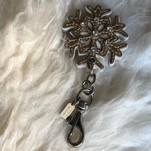 Coach Schlüsselanhänger Schneeflocke Winter Taschenanhänger gebraucht - Bild 1 von 2