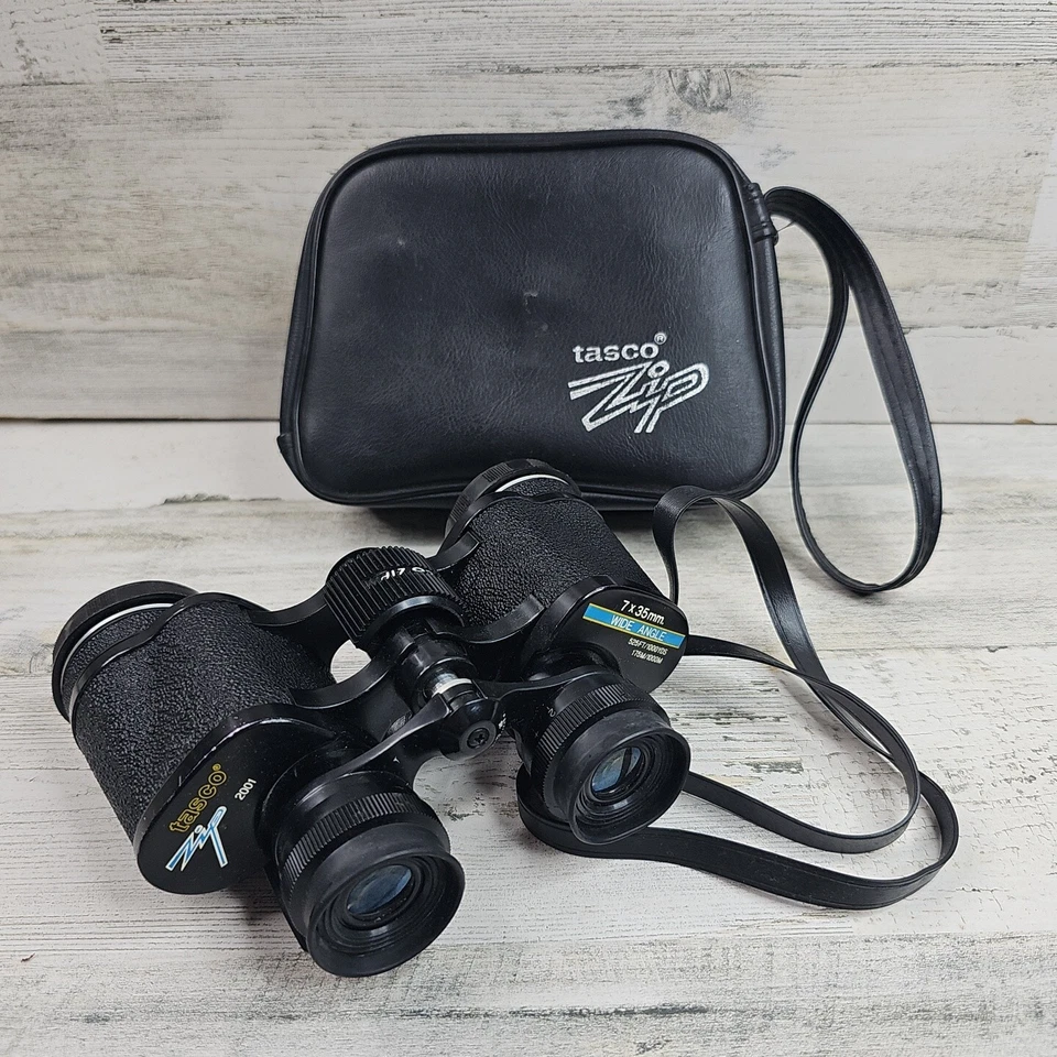Tasco Wide Angle and Rubber 2001 7x35MM Binoculars w/ Lens Caps and Strap - Image 1 of 4
