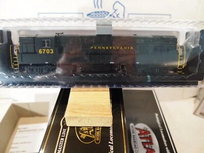 ATLAS 10004143 H.O.  FM-H24-66 "TRAINMASTER" PENNSYLVANIA  6703   WITH DCC+SOUND - Image 1 of 4