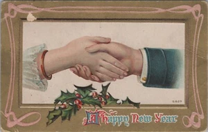 New Year handshake 2 hands man woman holly gold embossed c1920s postcard B113 - Picture 1 of 2
