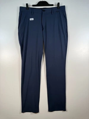 Pantalones chinos Travis Matthew para hombre rendimiento de golf elásticos preppy azules 36 18,5x32 Foto 1 de 4