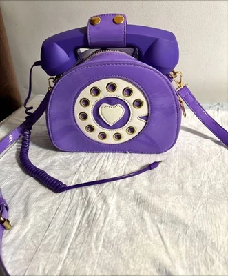 Cartera de teléfono giratoria retro puede contestar su teléfono desde el receptor Foto 1 de 4