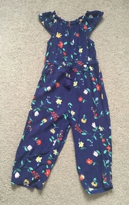 Next Girls Navy Floral Short Sleeve Jumpsuit. 6 Years. Excellent Condition - Picture 1 of 6