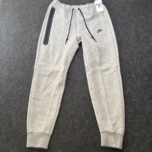 New Official Nike Tech Fleece Taped Jogger Pants FB8002-063 Men Sz M Club $125 - Picture 1 of 13