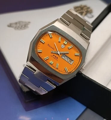 RELOJ AUTOMÁTICO CABALLERO VINTAGE NIVADA F77 ESFERA NARANJA AS. MOVIMIENTO 2066 Foto 1 de 4