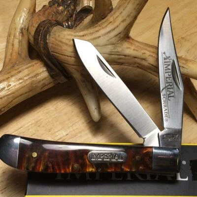 Navaja de bolsillo Imperial Schrade ámbar Swirl Trapper 3 1/2" IMP15T Foto 1 de 4