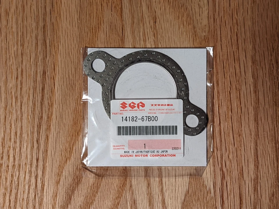Nueva pieza de junta de escape/silenciador genuina Suzuki # 14182-67B00 Foto 1 de 1