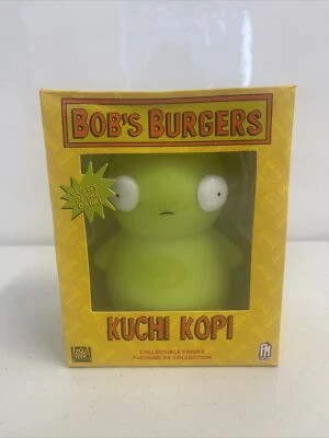Figura Vinilo Oficial Bob's Burgers Kuchi Kopi Brilla en la Oscuridad 5" Nueva  Foto 1 de 4