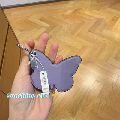 Nuevo con etiquetas Bolso Coach Mariposa Dije/Llavero CR903 Cuero Púrpura Violeta Claro Foto 1 de 4