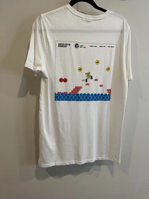 NUEVO CON ETIQUETAS Puma SUPER PLAY Camiseta Gráfica Retro Arcade Videojuego Top Hombres Talla M Foto 1 de 4