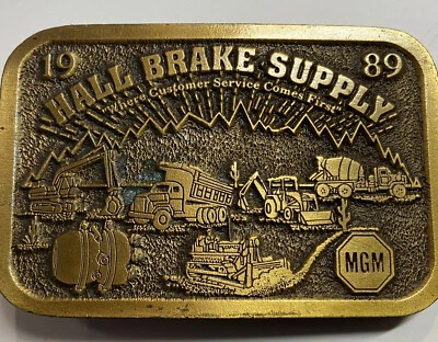 Bonita hebilla de cinturón de construcción agrícola MGM Hall Brake Supply 1989 vintage rara como nueva Foto 1 de 4