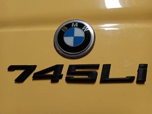 BMW 750I 750LI 2006-08 BLACK REAR TRUNK LID LETTERING EMBLEMS LOGO USED OEM - Picture 1 of 9