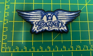 AEROSMITH BLUE WINGS WOVEN SEW OR IRON ON PATCH OFFICIALLY LICENSED ITEM - Imagen 1 de 8