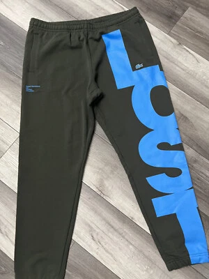 NUEVO CON ETIQUETAS PANTALONES DE CHÁNDAL LACOSTE PARA HOMBRE VERDE AZUL LOGO SPELLOUT TALLA XL Foto 1 de 4