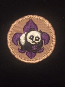 BOY CUB SCOUT "WORLD CONSERVATION " PATCH - OFFICIAL BSA - Panda purple tan - Picture 1 of 1
