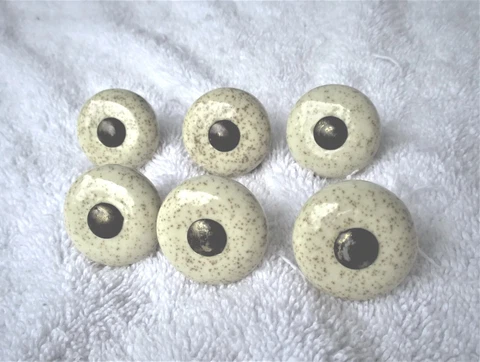 6-Vintage beige or  almond color speckled porcelain drawer pulls. Brass toned Cover
