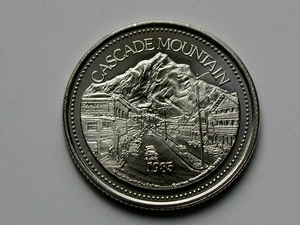 Banff AB CANADA 1985 Trade DOLLAR Token with Cascade Mountain from Banff Avenue - Bild 1 von 2