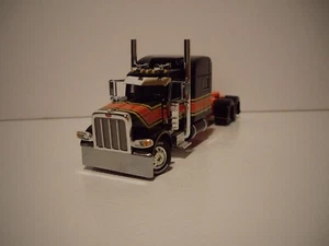 DCP FIRST GEAR 1/64 BLACK AND ORANGE PETERBILT 389 WITH 70'' MID-ROOF SLEEPER - Picture 1 of 4