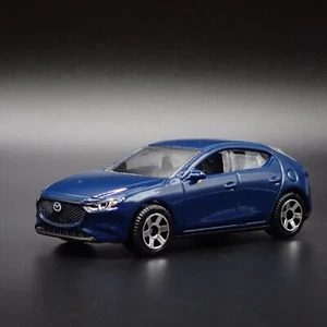 2019-2025 MAZDA 3 4 FOUR DOOR HATCHBACK 1:64 SCALE DIORAMA DIECAST MODELLAUTO - Bild 1 von 7