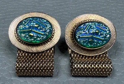 Gemelos enchapados en oro amarillo envolventes de piedra azul iridiscente Foto 1 de 2