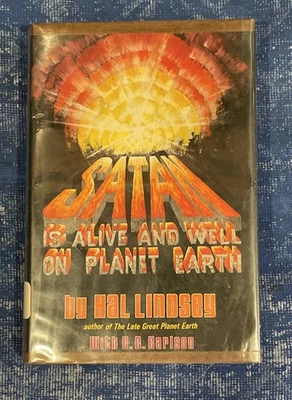 Satan Is Alive And Well On Planet Earth by Hal Lindsey HCDJ 1972 First Edition - Image 1 of 4