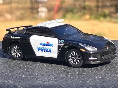 Neumático de goma Greenlight 2015 Nissan GT-R Oceanside California Police 1/64 diecast Foto 1 de 4