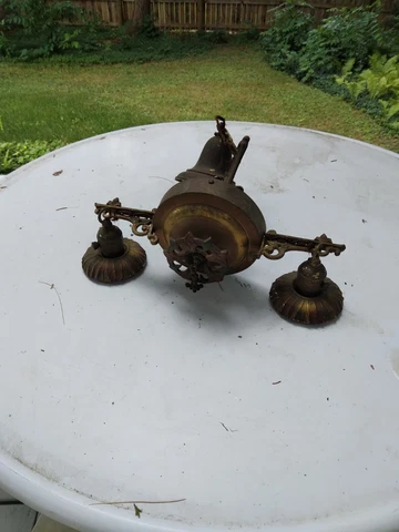 Antique metal Art Deco 2 arm chandelier. Lots of design/red and Green Cover