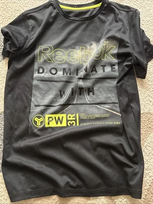 Camisa Reebok Dominate para niños, talla grande, negra y amarilla Foto 1 de 3