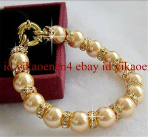 Natural 10mm Round Gold South Sea Shell Pearl & Gold Crystal Bracelet 7.5" AAA+ - Picture 1 of 4