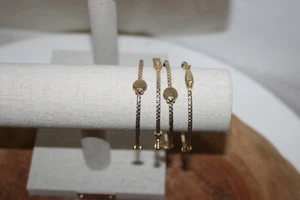 Lilly Pulitzer Set of 4 Bangle Bracelets Triple Fish & Seashells Gold Tone - Picture 1 of 3