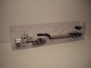 DCP PRIMERA MARCHA 1/64 MINNESOTA LIMITED 3 EJES PETE 389 CABINA CORTA CON EJE LOWBOY Y ABATIBLE - Imagen 1 de 8