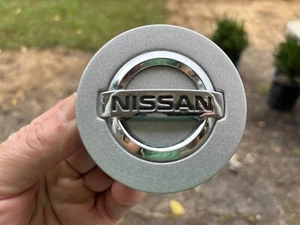 NISSAN FRONTIER XTERRA PATHFINDER OEM CENTER CAP SILVER 40342 EA210 2 3/4" DIAM - Picture 1 of 3