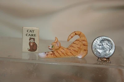 Miniature Dollhouse Orange Tabby Cat Stretching & Cat Book 1:12 - Image 1 of 4